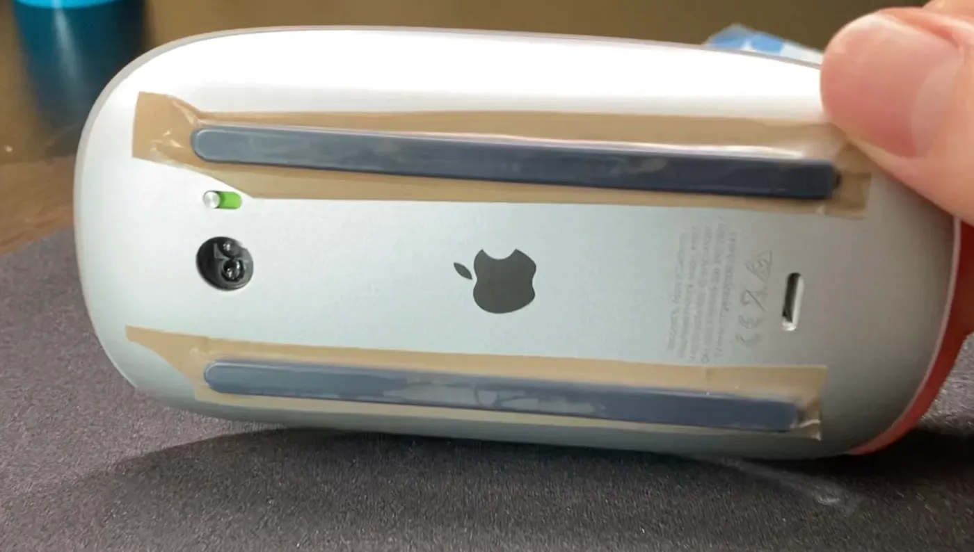 Magic Mouse with PTFE tape applied to the bottom rails